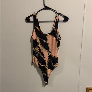 Stylish Black and Gold One Piece